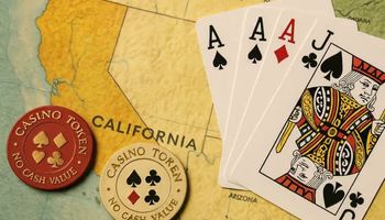 An image showing a California map with two casino chips and a hand of playing cards (two Aces and a Jack), capturing the essence of California's cardroom legal battle.