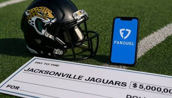 Jacksonville Jaguars football helmet on field with smartphone showing FanDuel app and a check for $5,000,000,