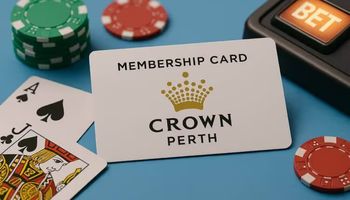 A Crown Perth membership card placed on a light blue surface with casino chips, blackjack cards, and a slot machine bet button.
