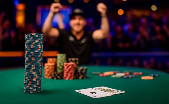 Poker table scene with chips and casually placed cards, evoking the aftermath of a Michael Mizrachi tournament win.